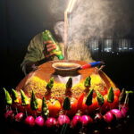 A photo of roasted gram being cooked, garnished with chillies, tomatoes, and onions - photography competition submission