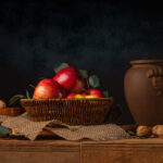 A photo of apples in a basket on an oak set of drawers - photography competition submission